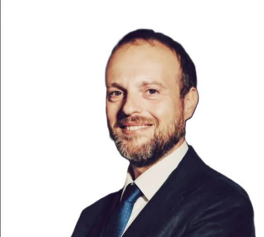Alessandro Iacovazzi, international business lawyer and founder of Iacovazzi International Law Firm, smiling in a suit and tie, representing expertise in corporate and cross-border legal consultancy.